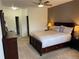 Spacious bedroom featuring a comfortable bed, neutral decor and bright lighting at 9557 W San Juan Cir # 207, Littleton, CO 80128