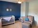 Bedroom with crib, chair and ceiling fan at 9557 W San Juan Cir # 207, Littleton, CO 80128