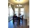 Cozy dining area featuring great natural light and a modern chandelier at 9557 W San Juan Cir # 207, Littleton, CO 80128