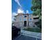 Beautiful condo building with stone accents and a well-maintained lawn on a sunny day at 9557 W San Juan Cir # 207, Littleton, CO 80128