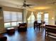 Inviting living area with hardwood floors, large windows, and a dining table at 9557 W San Juan Cir # 207, Littleton, CO 80128