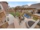 Aerial view of backyard featuring a cozy pergola, outdoor seating, fire pit, and well-maintained lawn for entertaining at 17124 Mariposa St, Broomfield, CO 80023