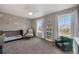Bedroom room with neutral colors and abundant natural light through two windows creates a cozy atmosphere at 17124 Mariposa St, Broomfield, CO 80023