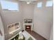 Open living room featuring a fireplace, large windows, and a soaring ceiling at 17124 Mariposa St, Broomfield, CO 80023