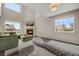 Bright living room with a soaring ceiling, fireplace, lots of windows and comfortable furniture at 17124 Mariposa St, Broomfield, CO 80023