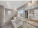 Relaxing main bathroom with a soaking tub, double vanities, and a separate shower at 17124 Mariposa St, Broomfield, CO 80023