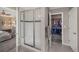 Elegant bathroom with a glass-enclosed shower and walk-in closet that connects to main bedroom at 17124 Mariposa St, Broomfield, CO 80023