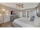 Cozy main bedroom featuring soft gray tones, a ceiling fan, and a large dresser at 17124 Mariposa St, Broomfield, CO 80023