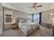 Spacious main bedroom with a ceiling fan, large windows, and plush carpet at 17124 Mariposa St, Broomfield, CO 80023