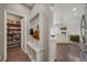 Mud room with storage bench and pantry; an open concept to the kitchen and living room at 17124 Mariposa St, Broomfield, CO 80023
