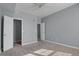 Bedroom with carpeted floor, ceiling fan, and walk-in closet at 12926 Ironstone Way # 201, Parker, CO 80134