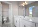 Bright bathroom with a white quartz countertop, modern vanity, and a shower/tub combination at 24801 E 33Rd Dr, Aurora, CO 80019