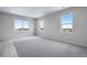 Bright bedroom with three windows providing natural light and views at 24801 E 33Rd Dr, Aurora, CO 80019