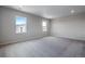 Large bedroom with neutral walls, carpet, and abundant light at 24801 E 33Rd Dr, Aurora, CO 80019