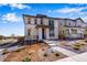 Beautiful two-story home featuring a stone entryway and tastefully landscaped front yard at 24801 E 33Rd Dr, Aurora, CO 80019