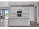 Modern kitchen with stainless steel appliances, subway tile backsplash, and center island at 24801 E 33Rd Dr, Aurora, CO 80019