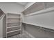 Bright walk-in closet features multiple rows of shelving and plentiful storage space at 24801 E 33Rd Dr, Aurora, CO 80019