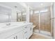 Modern bathroom with double vanity, frameless shower, and elegant tile work for a luxurious experience at 2031 Generations Aly, Brighton, CO 80601