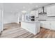 Modern kitchen featuring quartz counters, stainless appliances, and bright white cabinets at 2031 Generations Aly, Brighton, CO 80601