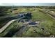 Aerial view of community featuring walking paths and a scenic bridge at 24263 E 41St Ave, Aurora, CO 80019