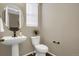 Simple and clean powder room with pedestal sink and toilet at 24263 E 41St Ave, Aurora, CO 80019