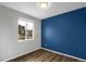 Bright bedroom with blue accent wall at 24263 E 41St Ave, Aurora, CO 80019