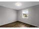 Simple bedroom with dark wood floors and a window at 24263 E 41St Ave, Aurora, CO 80019