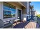 A spacious wood balcony featuring black iron railings and partial city views at 10305 Martin Luther King Blvd, Denver, CO 80238