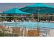 Community pool featuring various seating areas, lounge chairs, and a recreational pool at 10305 Martin Luther King Blvd, Denver, CO 80238