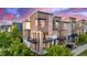 Aerial view of townhouse with private balconies, and modern architectural features at 10305 Martin Luther King Blvd, Denver, CO 80238