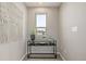 Upstairs hallway with modern decor, natural light, and a stylish console table at 10305 Martin Luther King Blvd, Denver, CO 80238