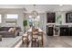 Bright kitchen with dining table, stainless steel appliances, and ample lighting at 10305 Martin Luther King Blvd, Denver, CO 80238