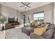 Comfortable living room with large sectional, TV, and natural light at 10305 Martin Luther King Blvd, Denver, CO 80238
