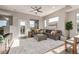 Bright living room with a cozy sectional, area rug and views at 10305 Martin Luther King Blvd, Denver, CO 80238