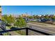 Exterior view of a nearby parking lot with retail storefronts visible from a nearby balcony at 10305 Martin Luther King Blvd, Denver, CO 80238