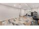 Spacious basement with fitness equipment and ample room for recreation and exercise at 162 Starlight Cir, Erie, CO 80516