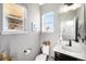 Cozy bathroom featuring a window, modern fixtures and decor, and neutral wall color at 162 Starlight Cir, Erie, CO 80516