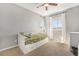 Bright bedroom with a trundle bed and natural light streaming through the large windows at 162 Starlight Cir, Erie, CO 80516