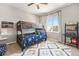 Fun bedroom with a bunk bed, playful decor, and a cozy atmosphere for children at 162 Starlight Cir, Erie, CO 80516