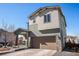 Stunning two-story home with a well-maintained lawn, stone accents, and a spacious two-car garage at 162 Starlight Cir, Erie, CO 80516