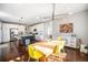 Modern kitchen with white cabinets, stainless steel appliances, and eat-in island at 162 Starlight Cir, Erie, CO 80516