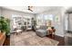Bright and airy living room with hardwood floors, large windows and comfortable seating at 162 Starlight Cir, Erie, CO 80516