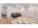 Finished basement with a comfortable seating area and a stylish geometric rug at 162 Starlight Cir, Erie, CO 80516