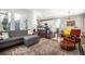Open-concept living space seamlessly connecting the living area to the kitchen and dining space at 162 Starlight Cir, Erie, CO 80516