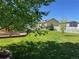 Beautiful backyard with lush greenery, a shed with a garden, and a white picket fence at 7930 Larkspur Cir, Frederick, CO 80530