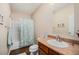 Bathroom with a tub and shower combination and a vanity with a decorative mirror and towel rack at 7930 Larkspur Cir, Frederick, CO 80530