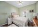 Comfortable bedroom with a queen bed, neutral tones, and soft textures for a relaxing retreat at 7930 Larkspur Cir, Frederick, CO 80530