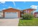 Charming single-Gathering home with a two-car garage, manicured lawn, and mature landscaping at 7930 Larkspur Cir, Frederick, CO 80530