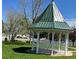 Charming gazebo surrounded by green grass and trees, perfect for relaxation at 7930 Larkspur Cir, Frederick, CO 80530
