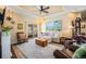 Comfortable living room featuring a sliding glass door, hardwood flooring, and modern decor at 7930 Larkspur Cir, Frederick, CO 80530